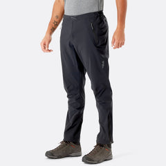 A pair of black Rab Men's Kinetic 2.0 Waterproof Alpine Pants with Stretch, featuring a slim fit and multiple zippered pockets.