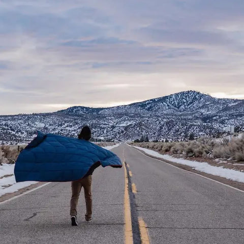 Rumpl Nanoloft Blanket 1 Person Deepwater in use