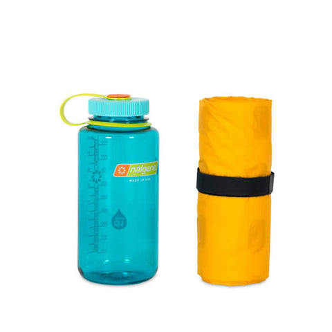 Nemo Tensor Insulated Regular Wide Hiking Mat packed next to bottle