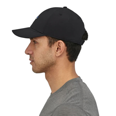 Patagonia Airshed Cap in use, side view, quick drying lightweight adventure sports cap