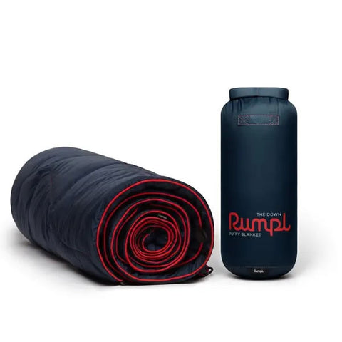 Rumpl Down Puffy 2 person blanket deepwater rolled next to stuff sack