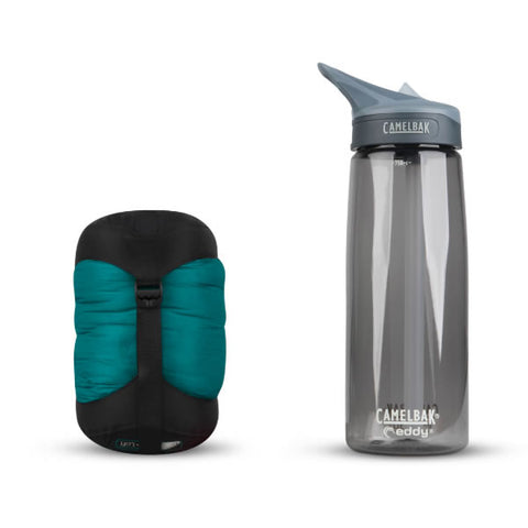 Sea to Summit Traveller Down Sleeping Bag end view packed down next to water bottle