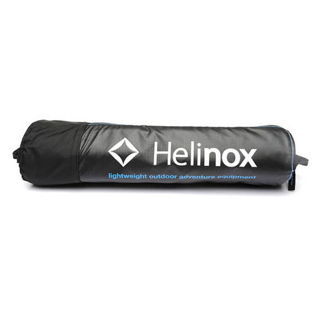 Helinox Table One assembled black top with blue frame packed into bag