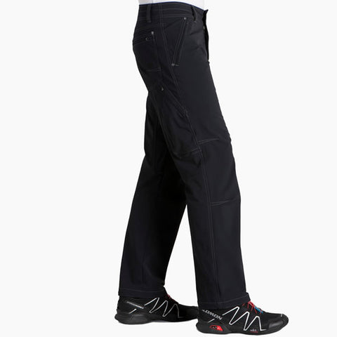 Kuhl Men's Destroyr Softshell Snowboard, Ski, Alpine Climb, Mountaineering Pant raven side view in use