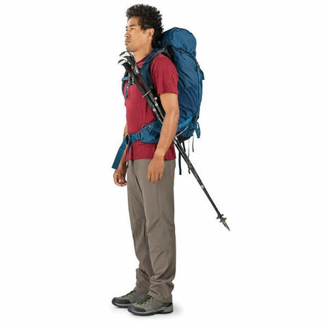 Osprey Kestrel 48 Litre Men's Hiking Backpack in use trekking poles attached